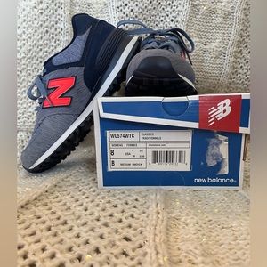 New Balance 574 shoes. Size 8M womens. Denim blue, orange, navy.